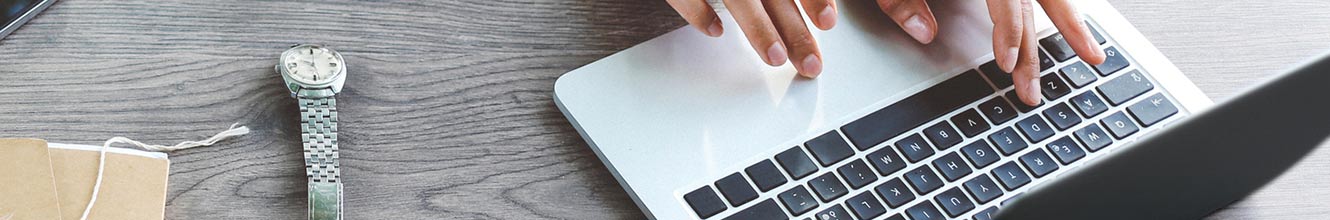 laptop on desk outdoors